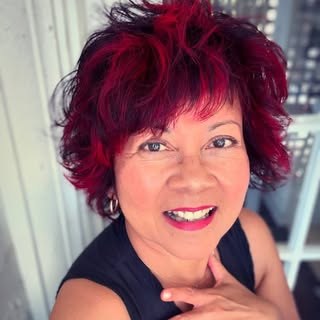 Nu Duggan, hair colorist and stylist, smiling